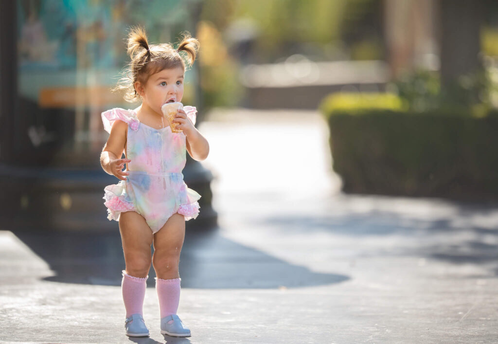 Toddler eating her ice cream at Jeni's ice cream in Calabasas, photographed by Los Angeles family photographer Elsie Rose Photography