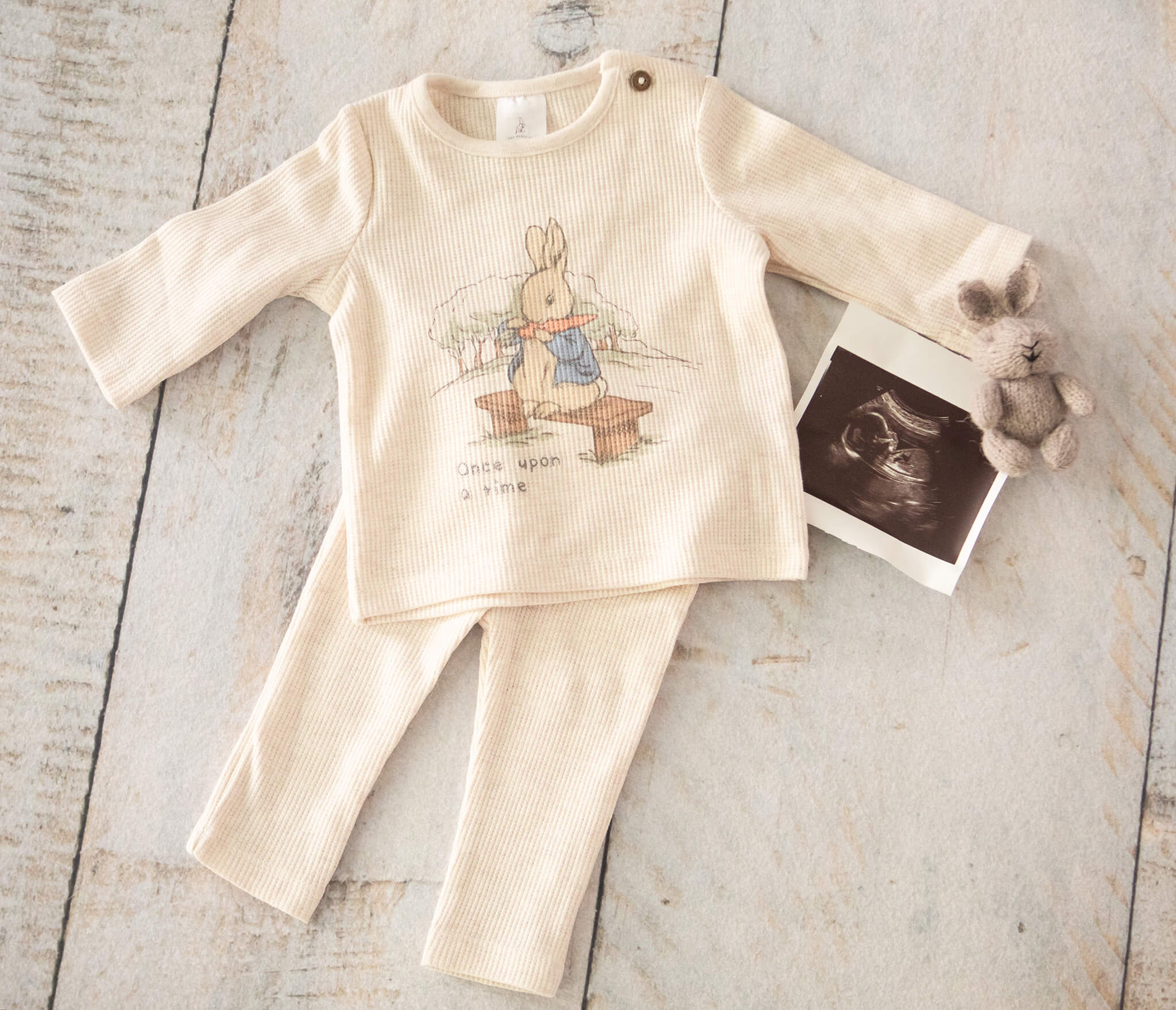 Peter Rabbit outfit for a newborn baby boy pictured side by side with the scan and a little rabbit teddy bear photographed by Los Angeles photographer Elsie Rose Photography - having a second baby