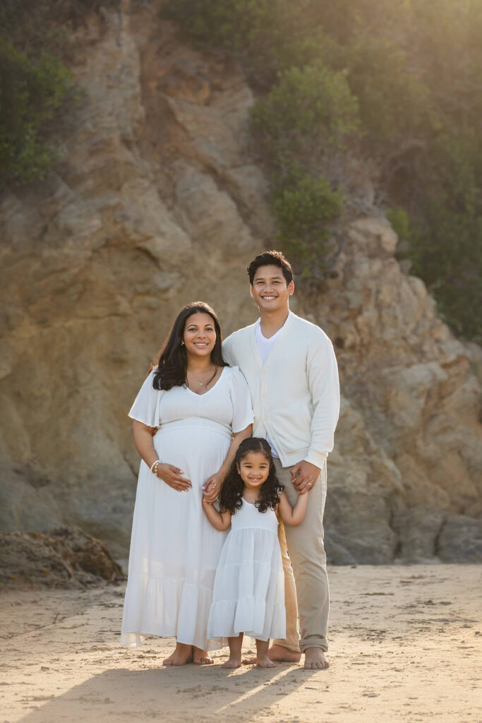Family of three at beach photoshoot in Malibu - Beverly Hills Hotels