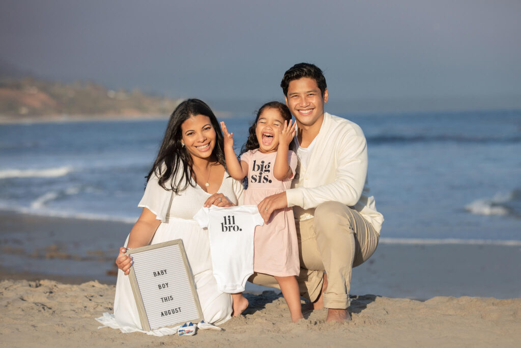 Baby announcement photoshoot in Malibu with big sister, mom and dad