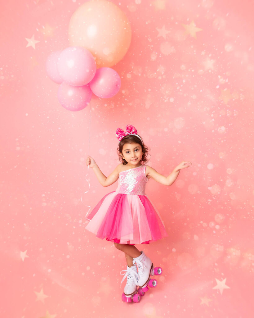 Barbie themed birthday with little girl in Barbie dress and roller skates - Posh and Petite Playhouse Woodland Hills