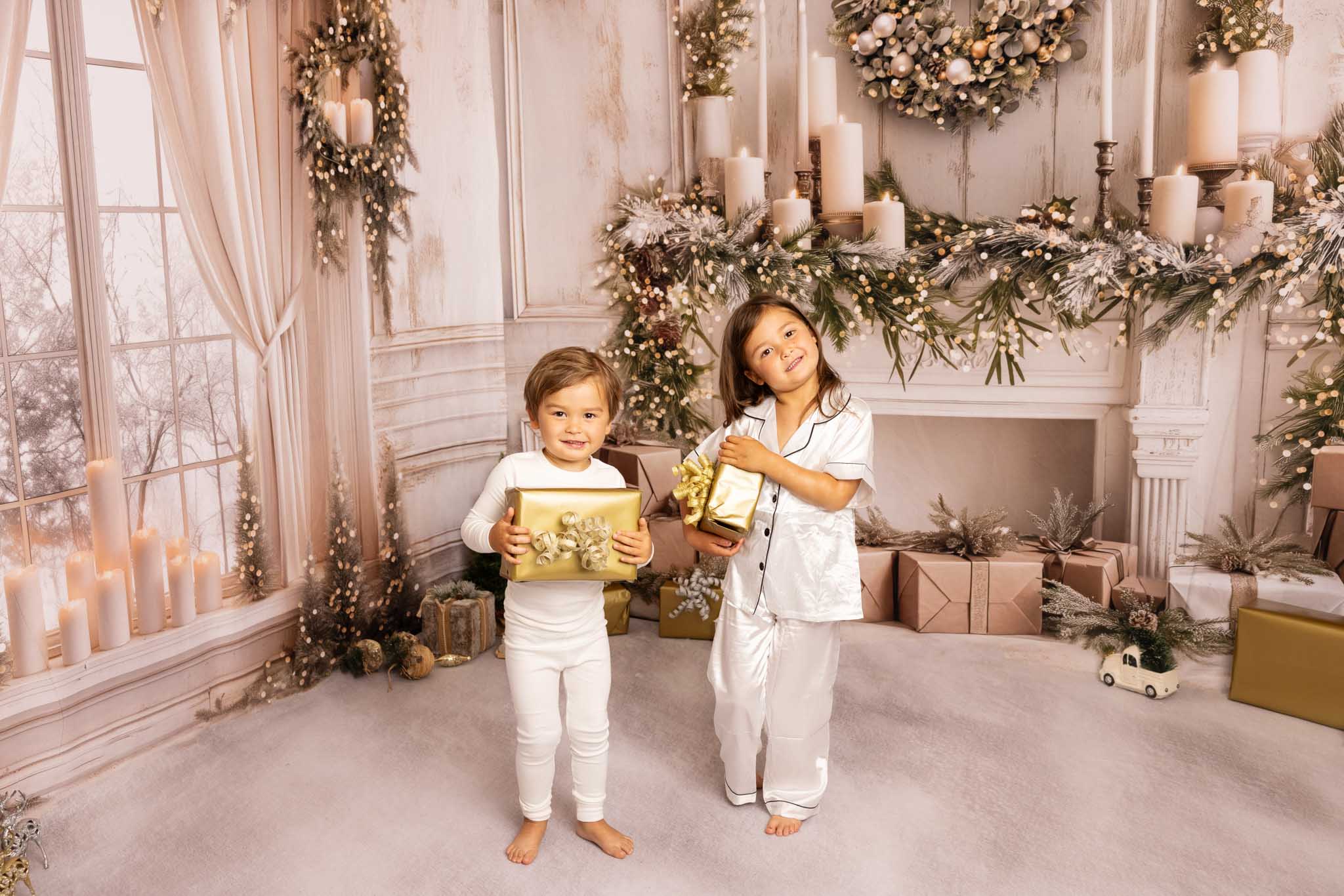Two children with gold wrapped presents at Christmas in LA - Christmas Activities in Los Angeles