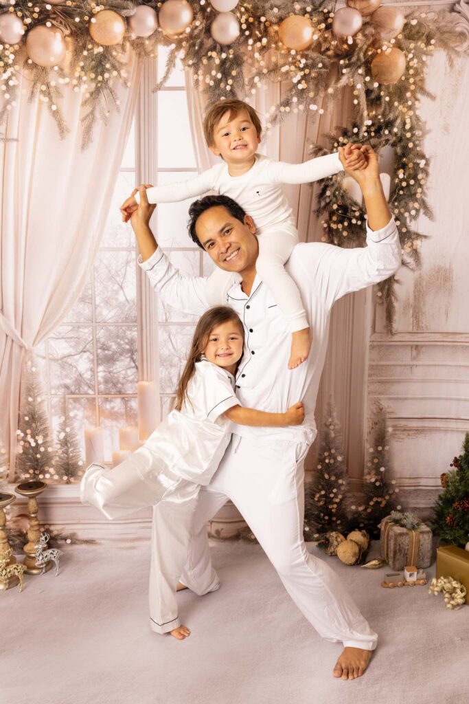 Dad with his two children in Christmas pjamas - Christmas Activities in Los Angeles