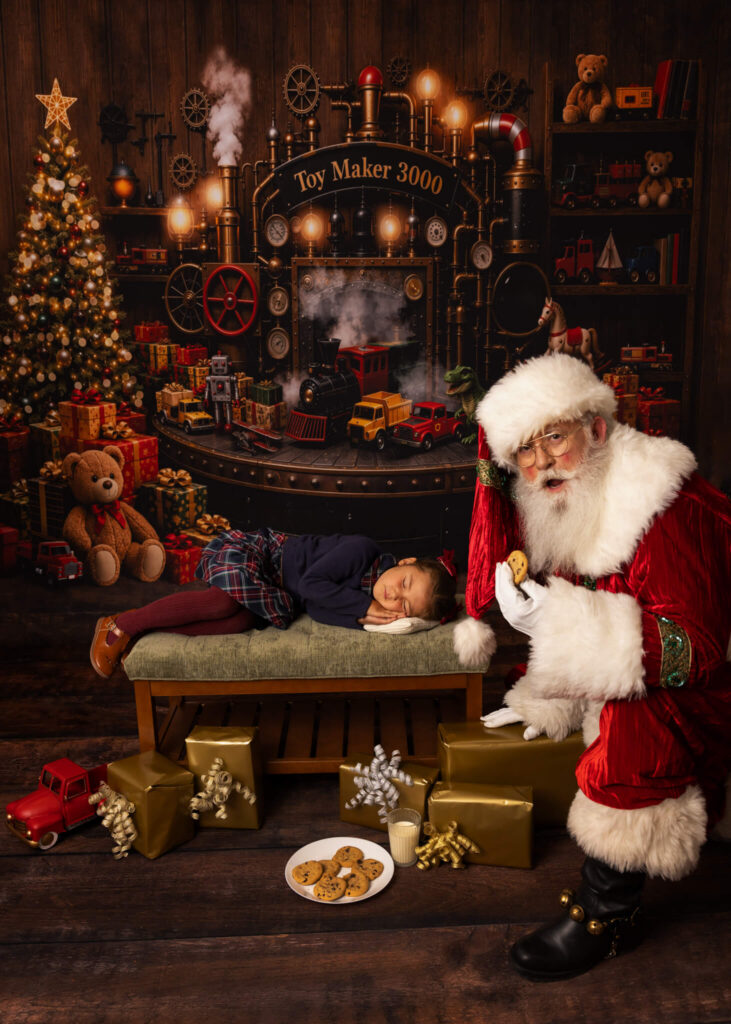 Little girl asleep with presents all around and Santa eating cookies