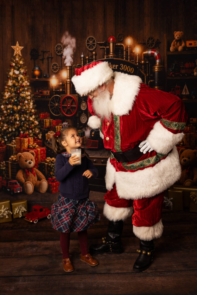 Little girl with a glass of Milk stolen from Santa in a funny picture taken in Los Angeles