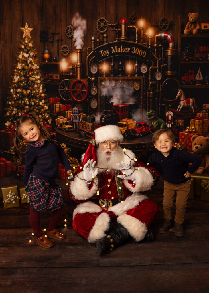 Santa wrapped in lights by little girl and boy in a funny image for Christmas time