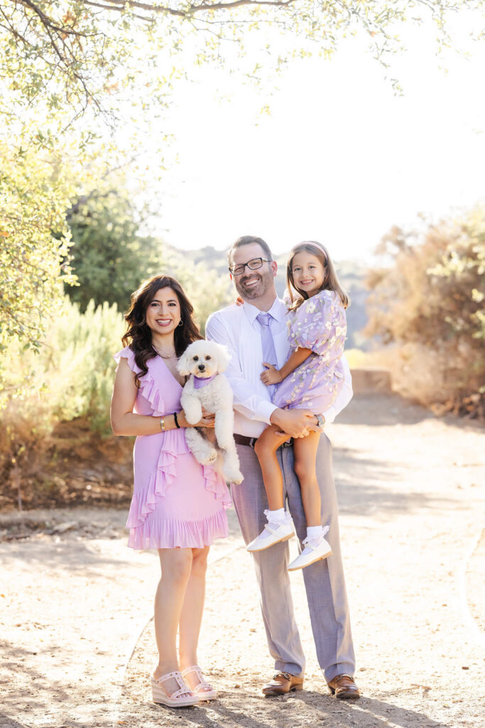 Family of 3 and their dog at a Fall session. Wearing lilac. Things to do in LA in October